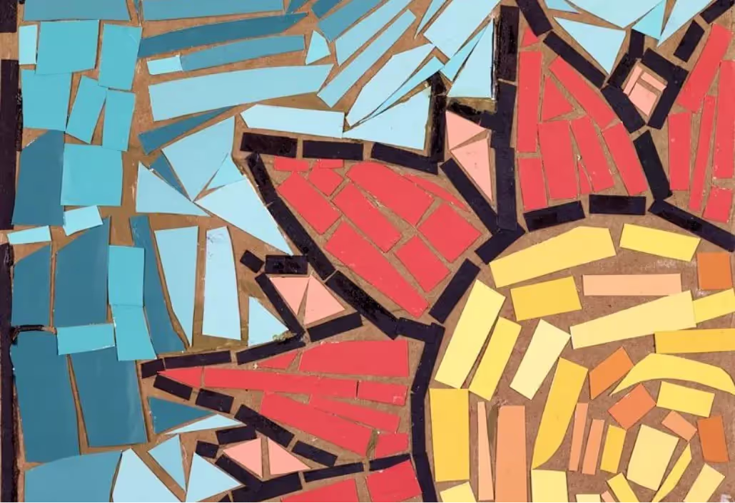 A sunflower made out of broken pieces of glass